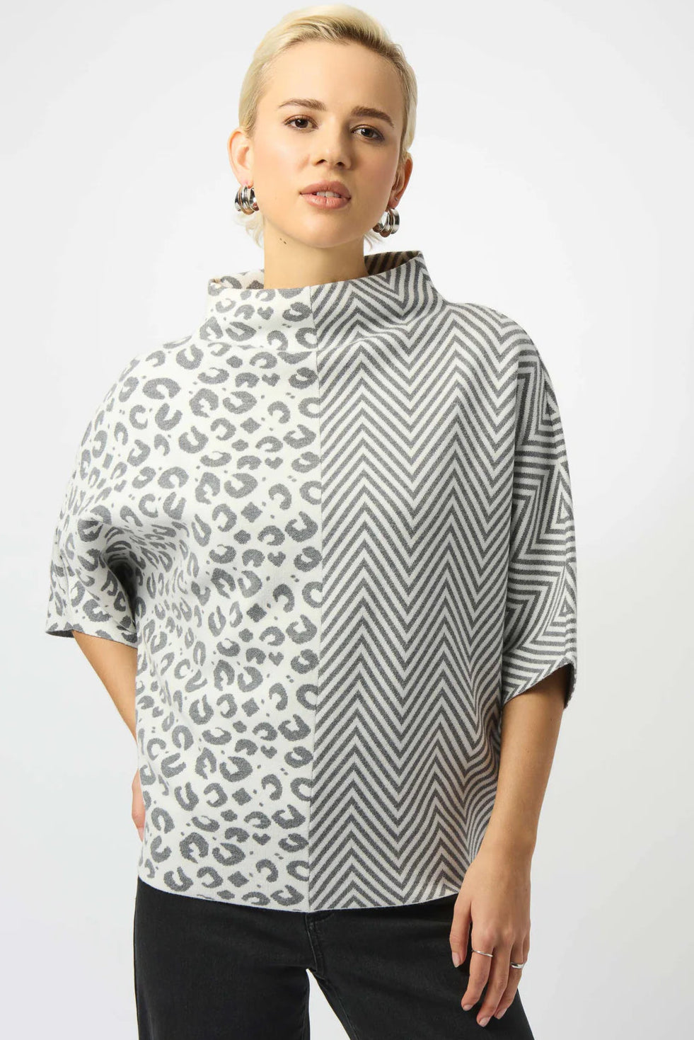 Woman wearing a patterned shirt with a white background