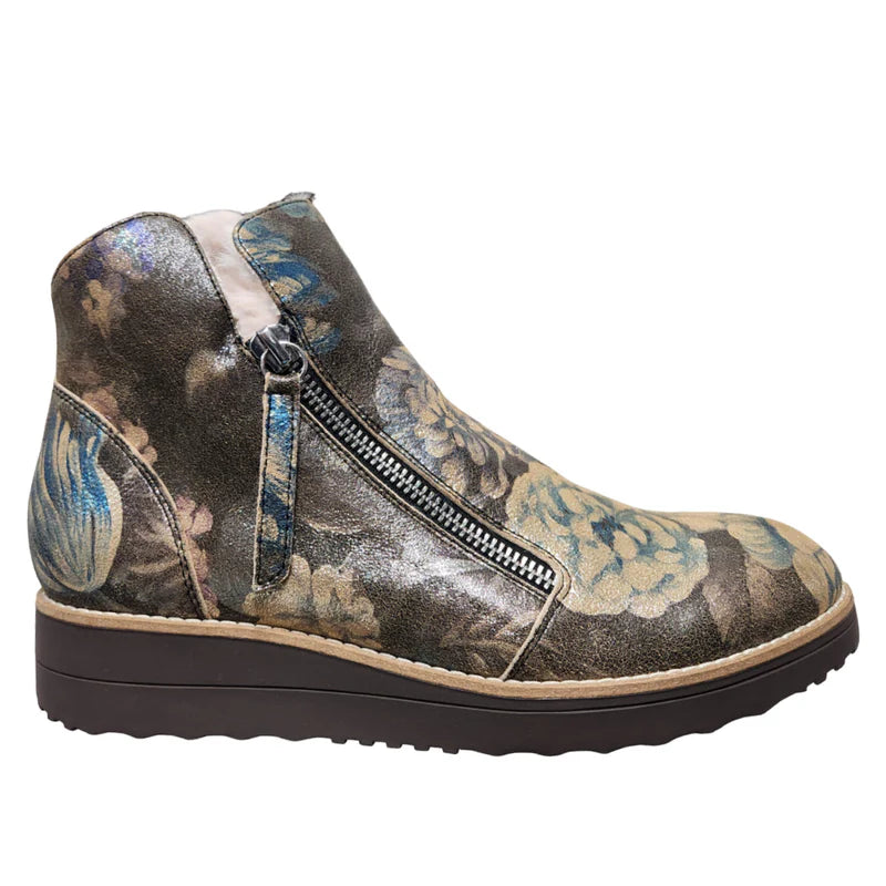 Floral patterned ankle boot with a zipper on a white background