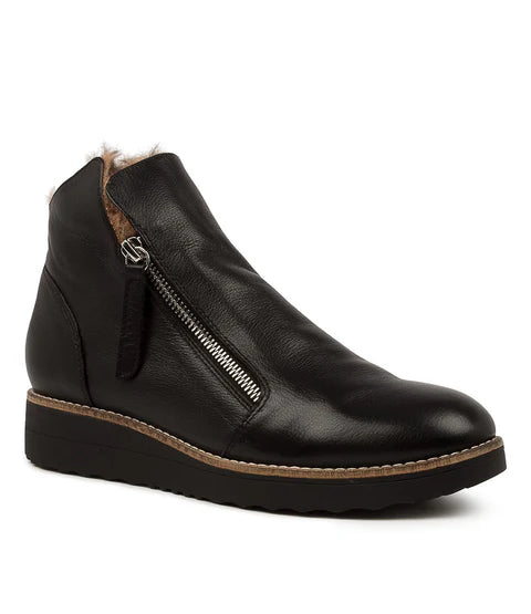 Black ankle boot with zipper on a white background