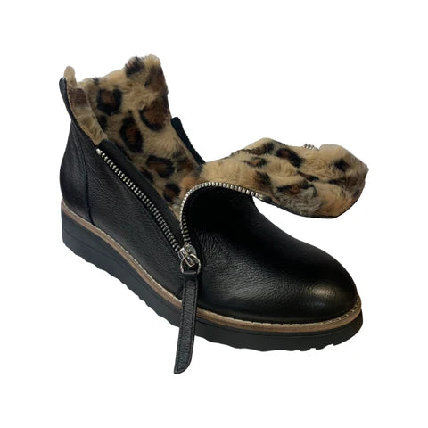 Black ankle boot with leopard print fur lining on a white background